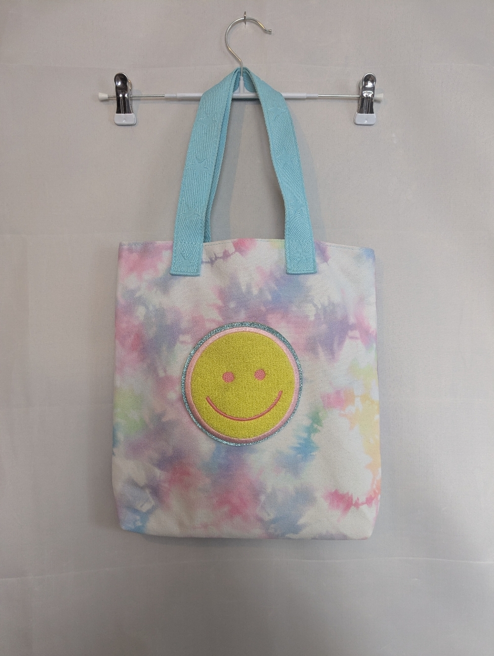 Claire’s Tie Dye Smiley Face Canvas Tote Bag Pastel Blue Pink